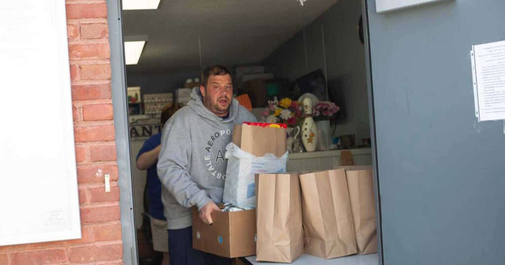 Volunteer Wesley Pullen helps out in Margaret's Pantry.